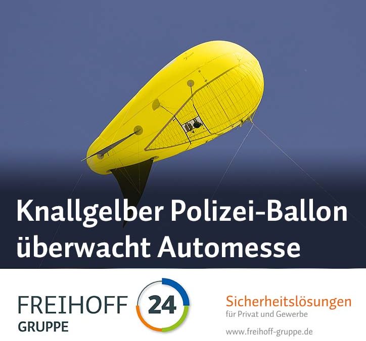 Knallgelber Polizei-Ballon überwacht Automesse