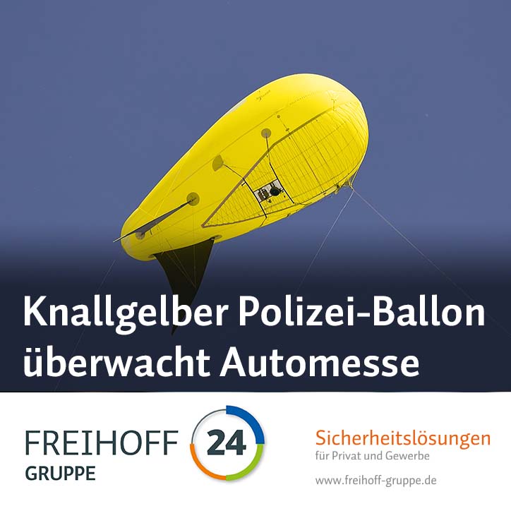 knallgelber Polizeiballon überwacht messe